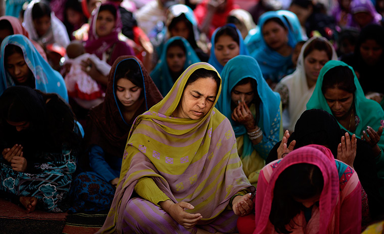 Easter Sunday: Christians pray at an Easter Mass in a Christian neighbourhood in Islamabad