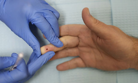 An HIV test is conducted at the Whitman-Walker Health Elizabeth Taylor Medical Center