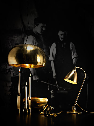 homes - metals: brass lamps against dark background