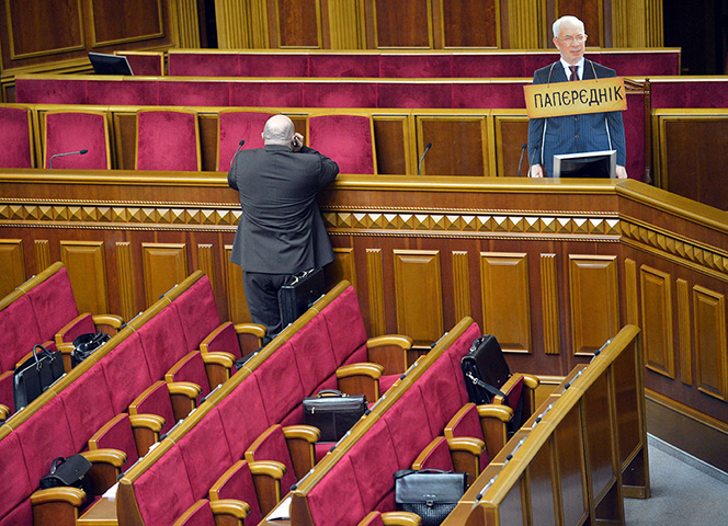 24 hours in pictures: Cardboard cut-out of Ukrainian Prime Minister Mykola Azarov