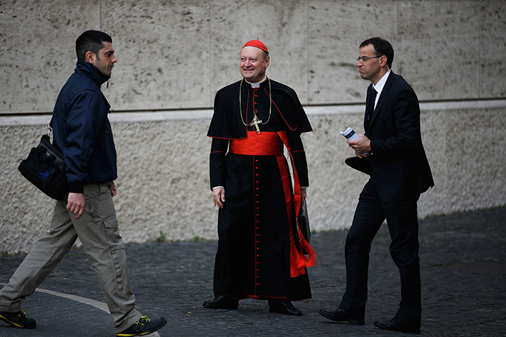 24 hours in pictures: Cardinal Gianfranco Ravasi, of Italy, arrives for a meeting, at the Vatican