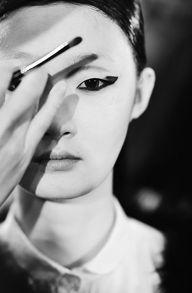 Paris fashion in B&W: A model backstage before the Tsumori Chisato show