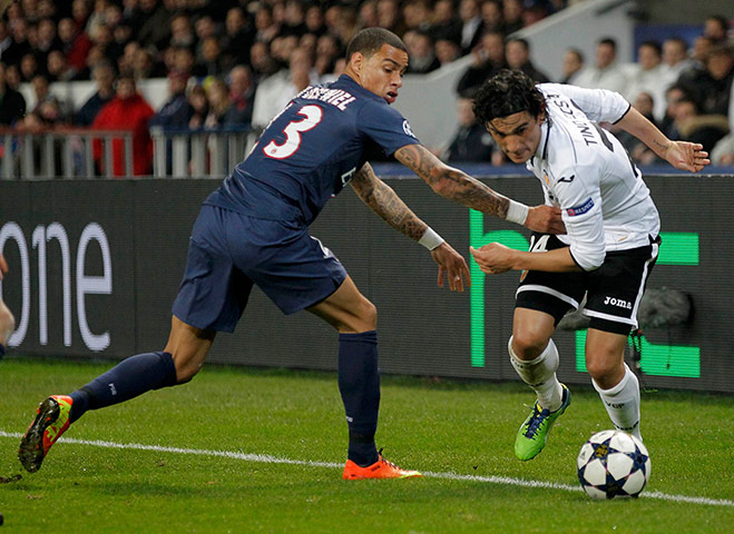 Wed champions league: Valencia's Tino Costa skips past PSG's Gregory Van Der Wiel