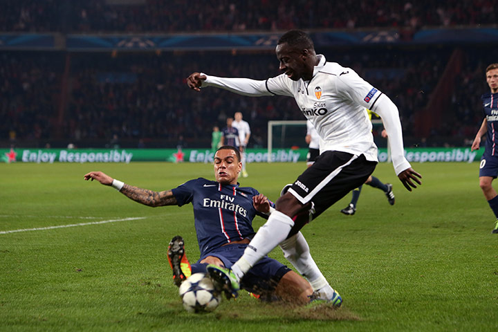 Wed champions league: Gregory Van Der Wiel blocks a cross from Valencia's Aly Cissokho 