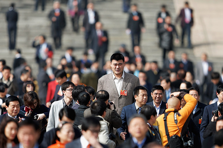 24 hours in pictures: Yao Ming, former NBA basketball, walks out the Great Hall of the People