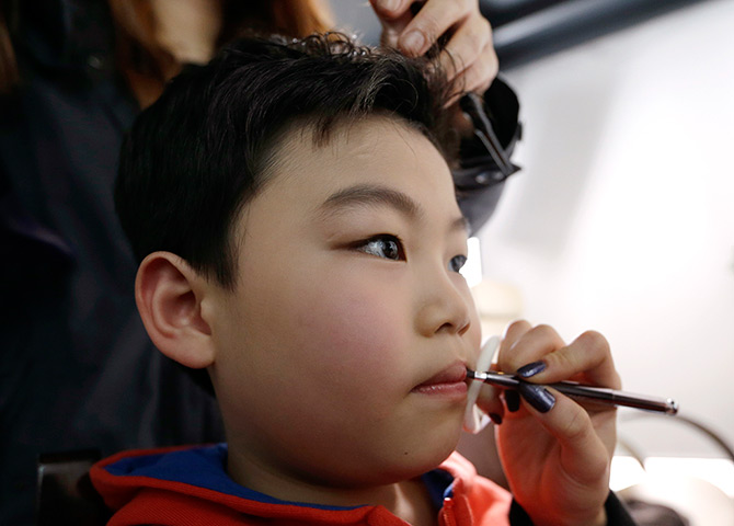 24 hours in pictures: Hwang Min-woo, also known as a Little PSY has his makeup done