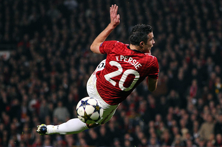 20 Photos: Manchester United's Robin Van Persie miss-kicks the ball against Real Madrid