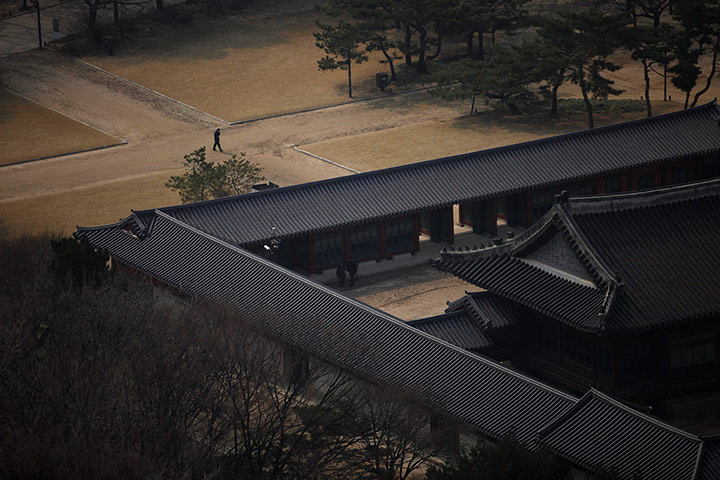 20 Photos: A man takes a walk during lunch break at Deoksu Palace in Seoul, South Korea
