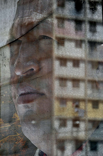 20 Photos: A view of a translucent banner with a portrait of Hugo Chávez