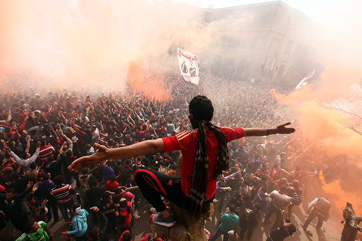 Al-Ahly fans celebrate in Cairo after a court confirmed the death penalty for 21 rioters