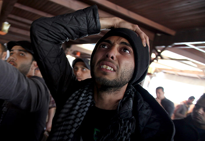 An Egyptian man watches the televised court verdict in a coffee shop in Port Said