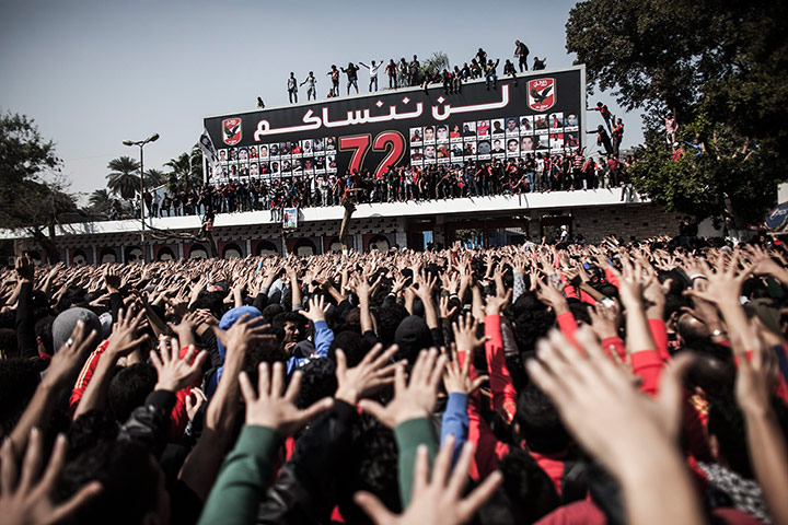 Al-Ahly supporters in Cairo, Egypt, react to the verdict