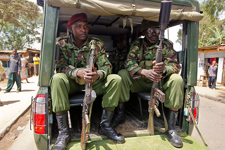 Paramilitary police officers of the General Service Unit patrol the streets of Din the Kibera slum, Raila Odinga's stronghold in Nairobi