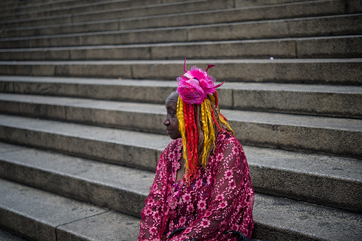 24 hours: An activist watches as women protest against violence towards women
