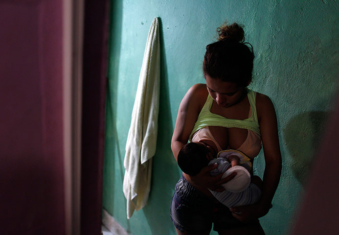 24 hours: Nair Romana feeds her 20-day-old son Kaua 