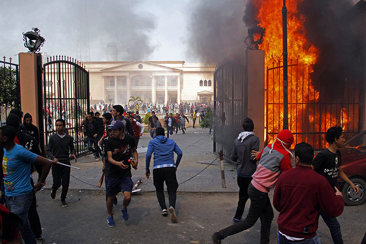 Port Said: Al-Ahly club supporters run away from smoke and flames