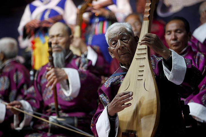 24 hours: Lijiang, China: Members of the Naxi Ancient Music Orchestra perform