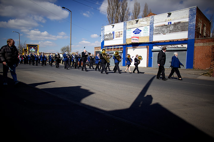 maltby colliery closes: A brass band plays during the parade through the village