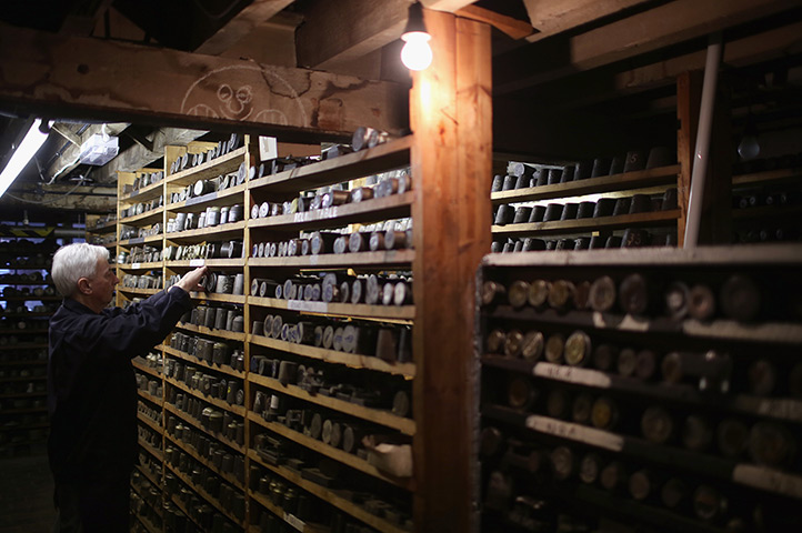 FTA: Christopher Furlong: Craftsmen Joe Cunningham selects a stamping die from a selection of 250,000