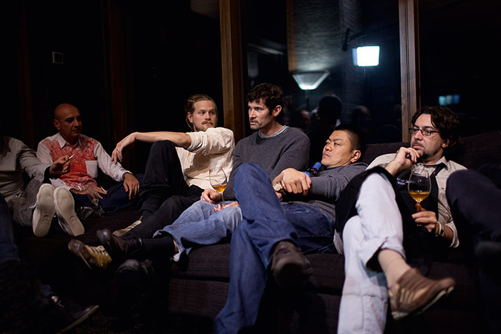 Cook it raw: The chefs relax with a glass of wine after the meal is over