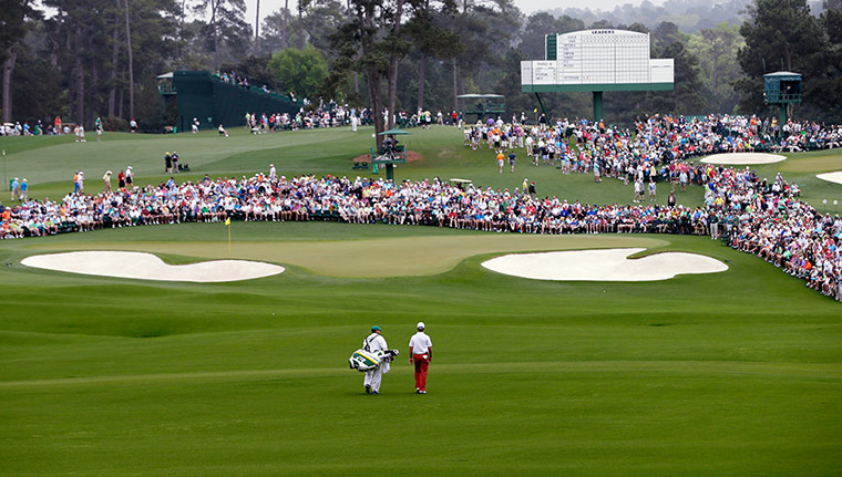 augusta day 1: Mike Weir walks with his caddie Danny Sahk to the second hole 