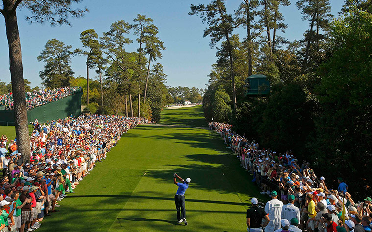 augusta day 1: Tiger Woods plays his tee shot on the 18th hole 