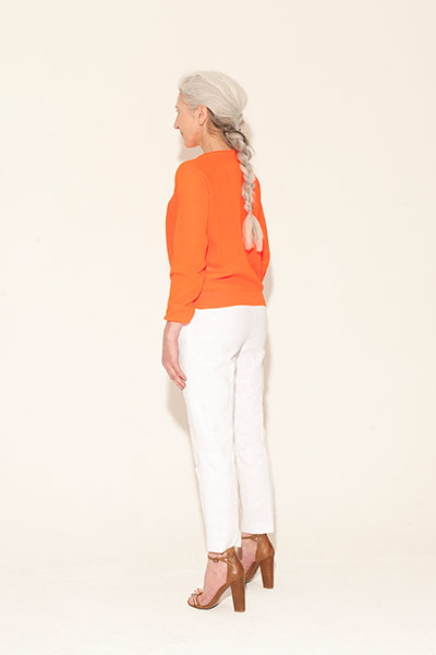 All Ages : orange long sleeved sweater white trousers