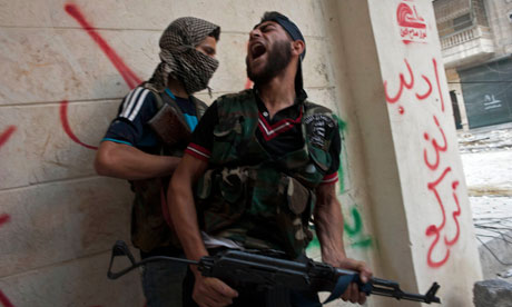 Free Syrian Army fighters take cover as they exchange fire