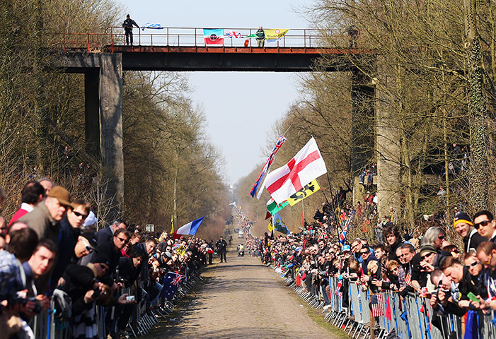 best of the week: Fans in the Arenberg Forest wait for the pelaton to pass by