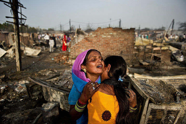 20 Photos: Residents of Bawana, India, weep after home destroyed 