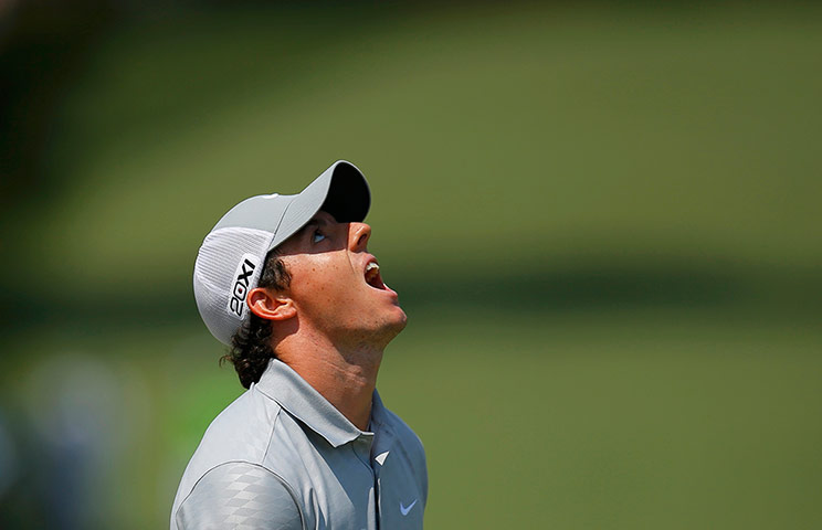 Augusta day 2: Rory McIlroy reacts after sinking a par putt on the seventh 