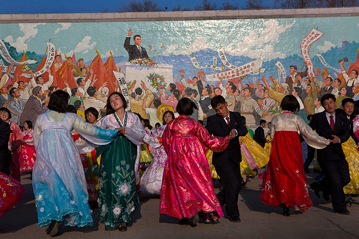 20 Photos: North Koreans dance under a mosaic painting of the late leader Kim Il-sung