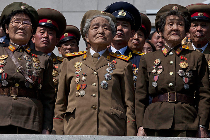 24 Hours: Retired North Korean military members stand to attention in Pyongyang