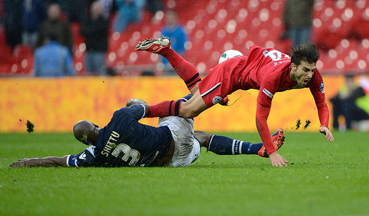 FA Cup semi: Danny Shittu of Millwall tackles Jordi Gomez of Wigan 