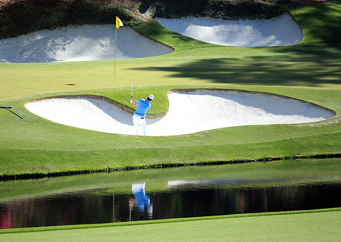 golf day 3: Justin Rose hits out of the bunker on the 12th