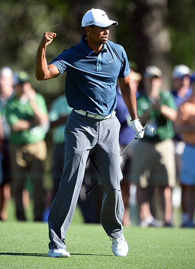 golf day 3: Tiger Woods of the US pumps his fist