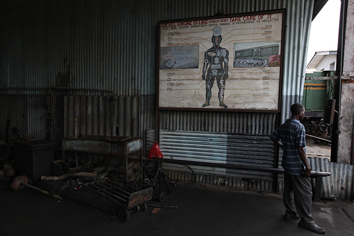 24 hours: Lagos, Nigeria: An engineer stands near a sign