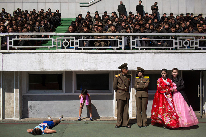 24 hours: Pyongyang, North Korea: Runners rest in Kim Il Sung Stadium