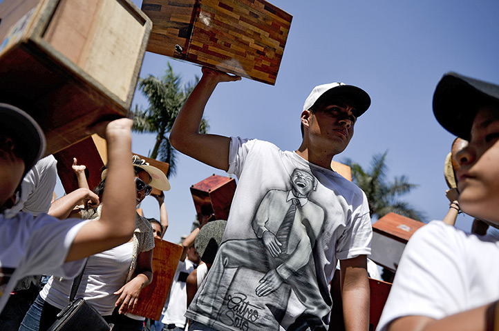 24 hours: Lima, Peru: Participants carry their Cajones