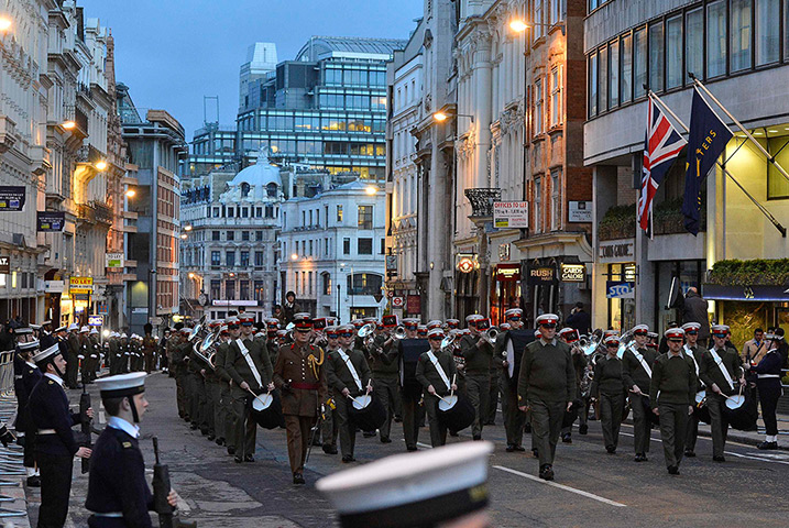 Rehearsal: Members of Britain's Armed forces march up Ludgate Hill 