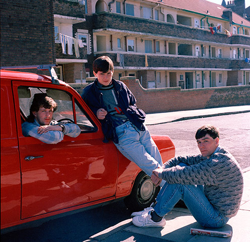 Big Picture - Rob Bremner: three young boys sitting and standing next to red van