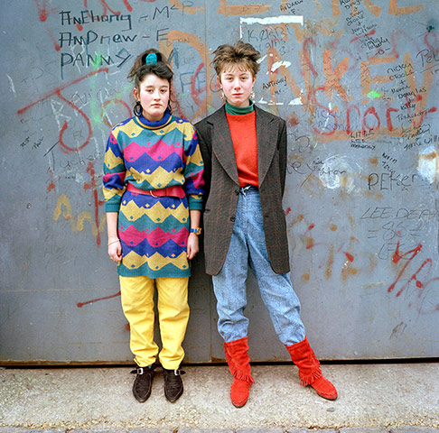 Big Picture - Rob Bremner: two young girls dressed in fashions from the eighties against graffiti wall