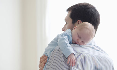 Father holds newborn