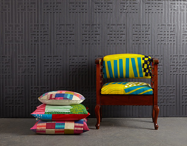 Homes - Chairs: chair with yellow and green fabric against a grey wallpapered background
