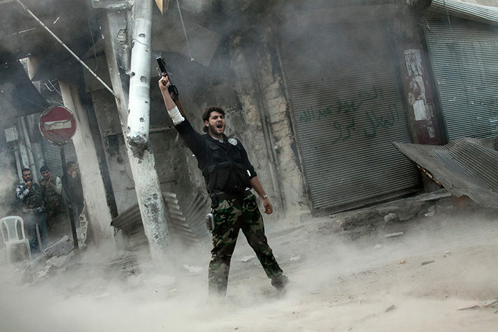 Pulitzer prize: A rebel fighter gestures after firing a shoulder-fired missile