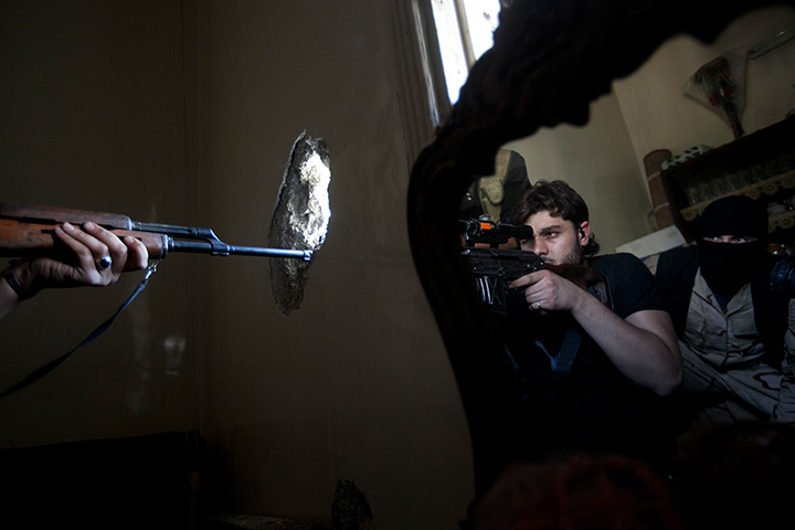 Pulitzer prize: A rebel sniper aims at a Syrian army position