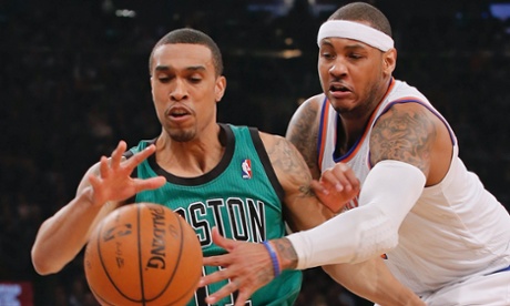 New York Knicks forward Carmelo Anthony tries to steal the ball from Boston Celtics guard Courtney Lee (L) in the first quarter of their NBA basketball game at Madison Square Garden in New York, March 31, 2013. REUTERS/Ray Stubblebine (UNITED STATES - Tags: SPORT BASKETBALL) :rel:d:bm:GF2E94102M401