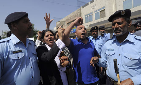 Supporters of Pervez Musharraf chant after the Islamabad high court orders his arrest