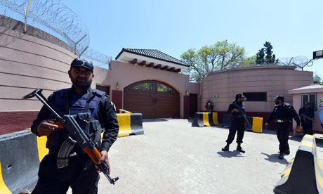 Police stand guard outside the home of former the Pakistani president Pervez Musharraf