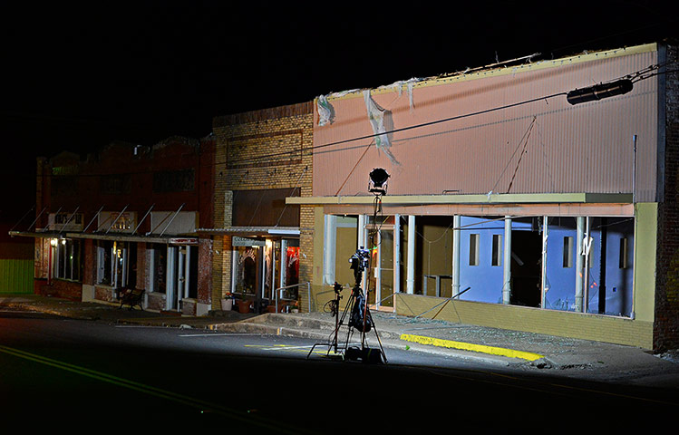 Texas explosion: A television station sets up in front of a building with windows blown out